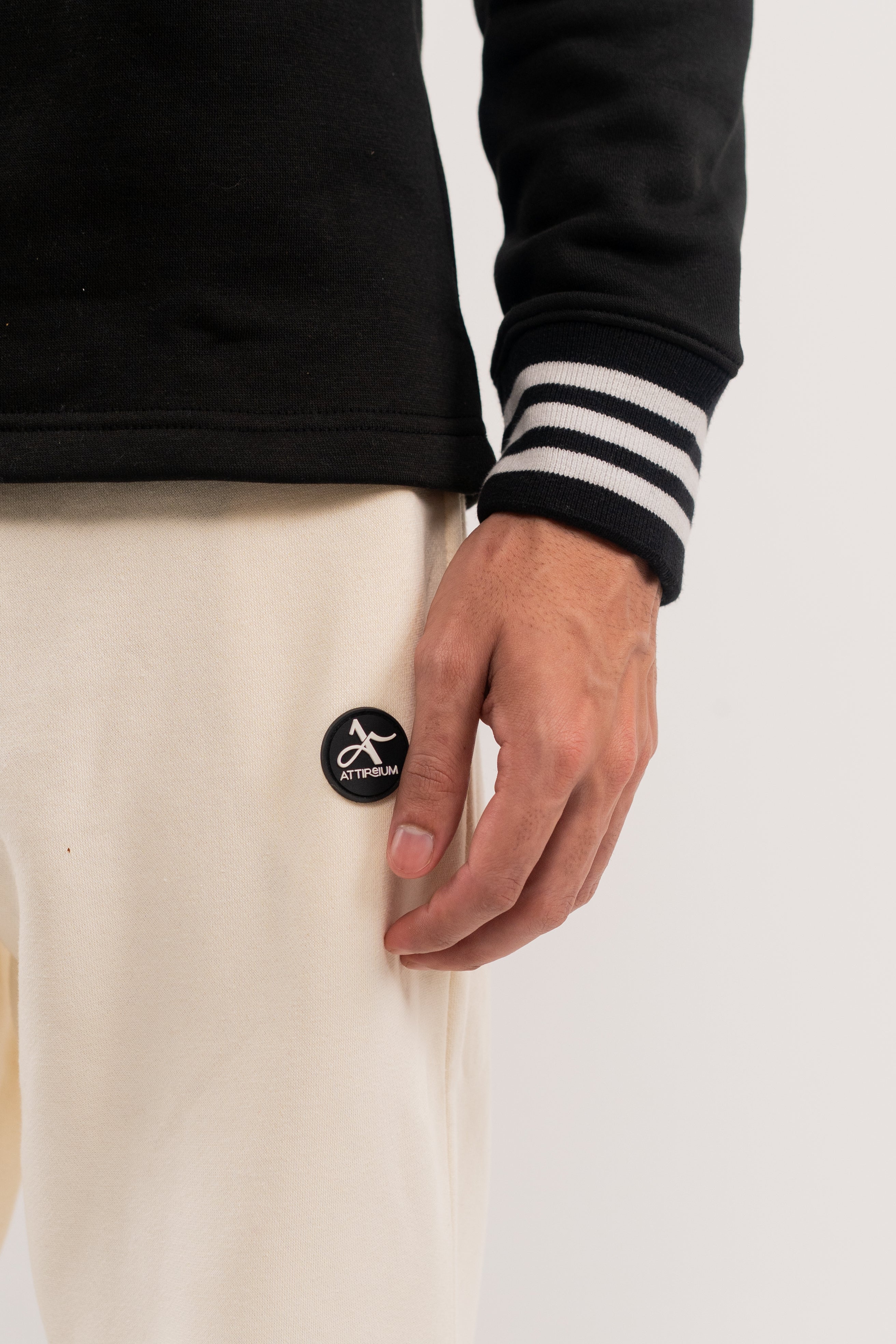 Classic Black Half-Zip Pullover with Striped Collar and Cuffs