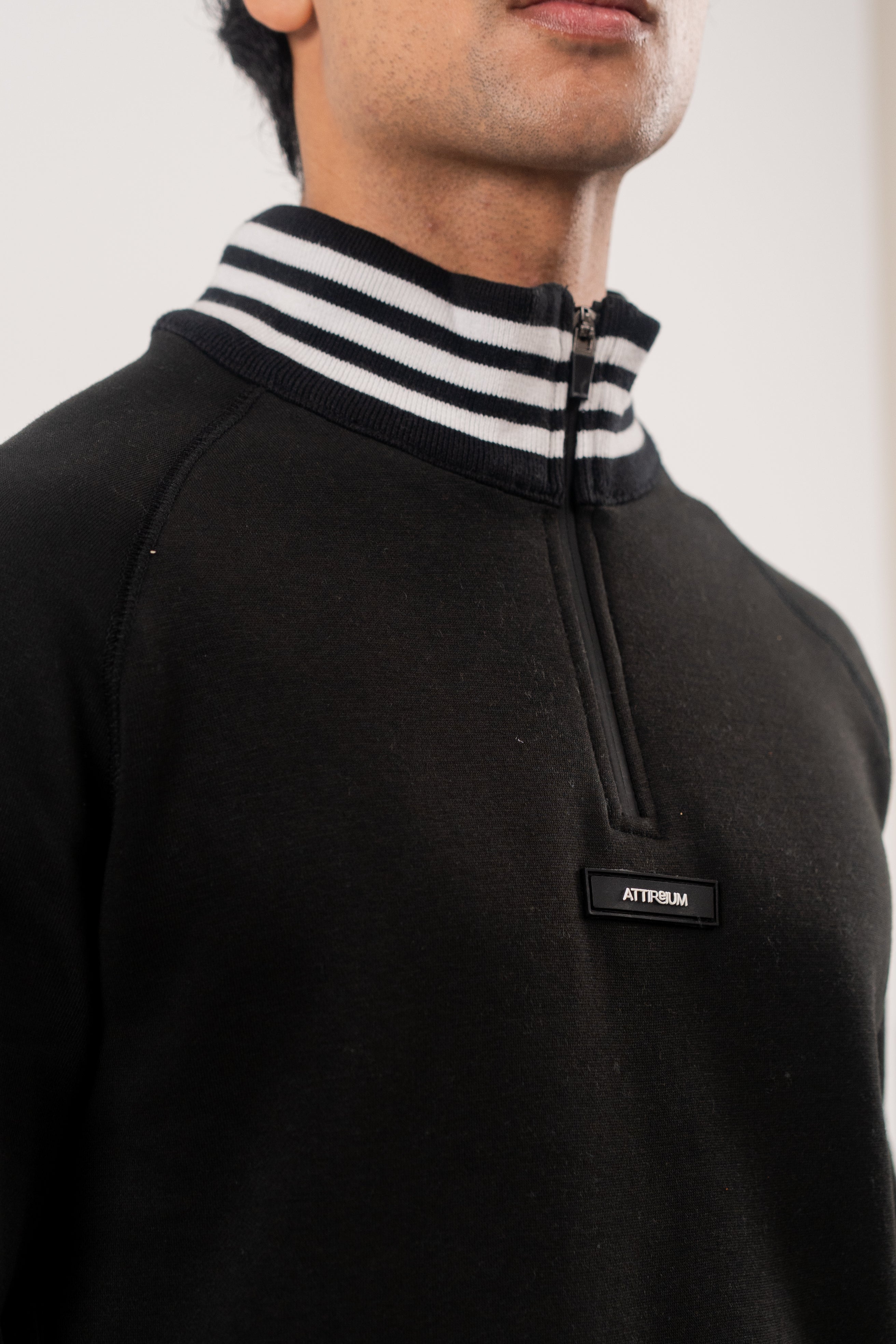 Classic Black Half-Zip Pullover with Striped Collar and Cuffs