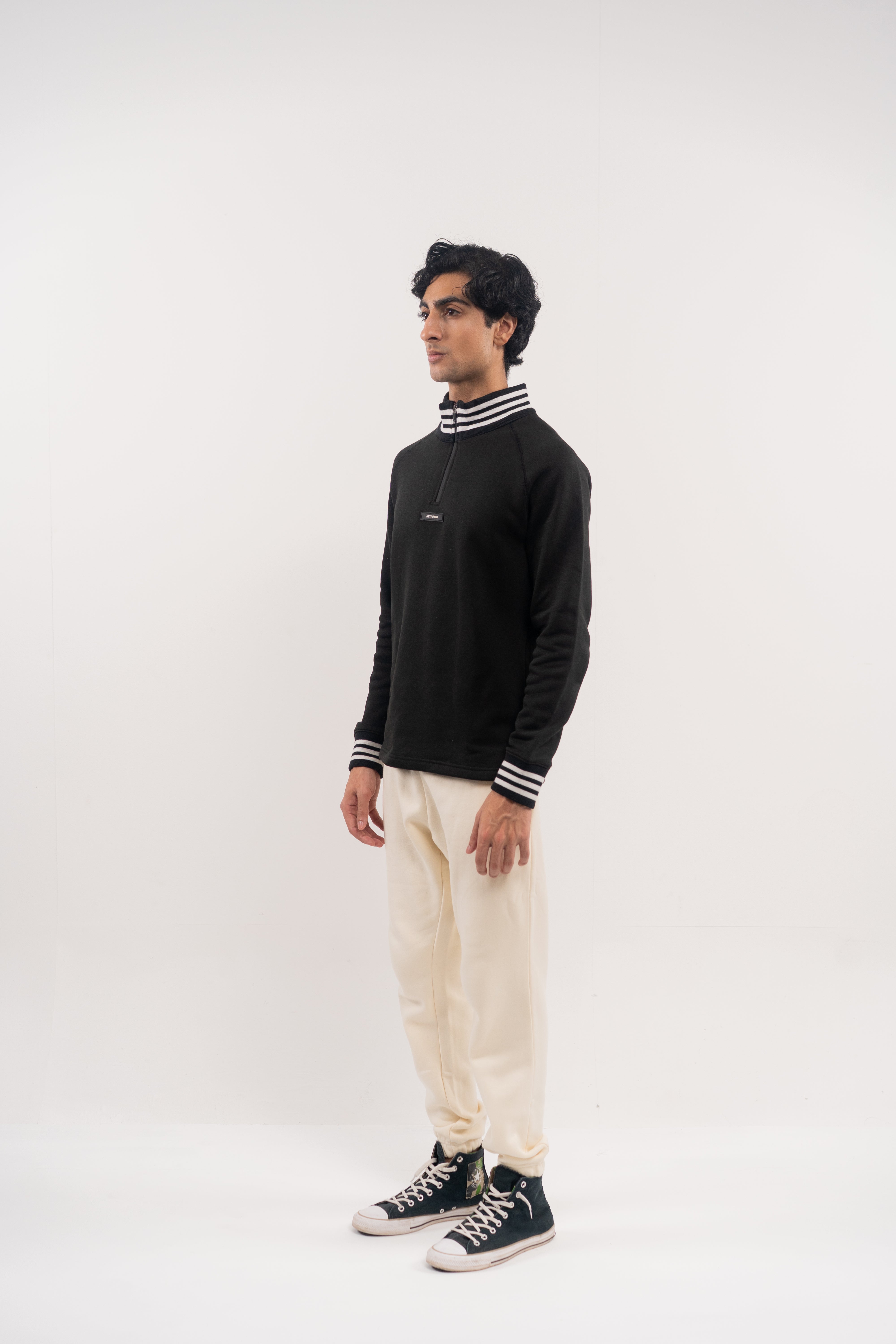 Classic Black Half-Zip Pullover with Striped Collar and Cuffs