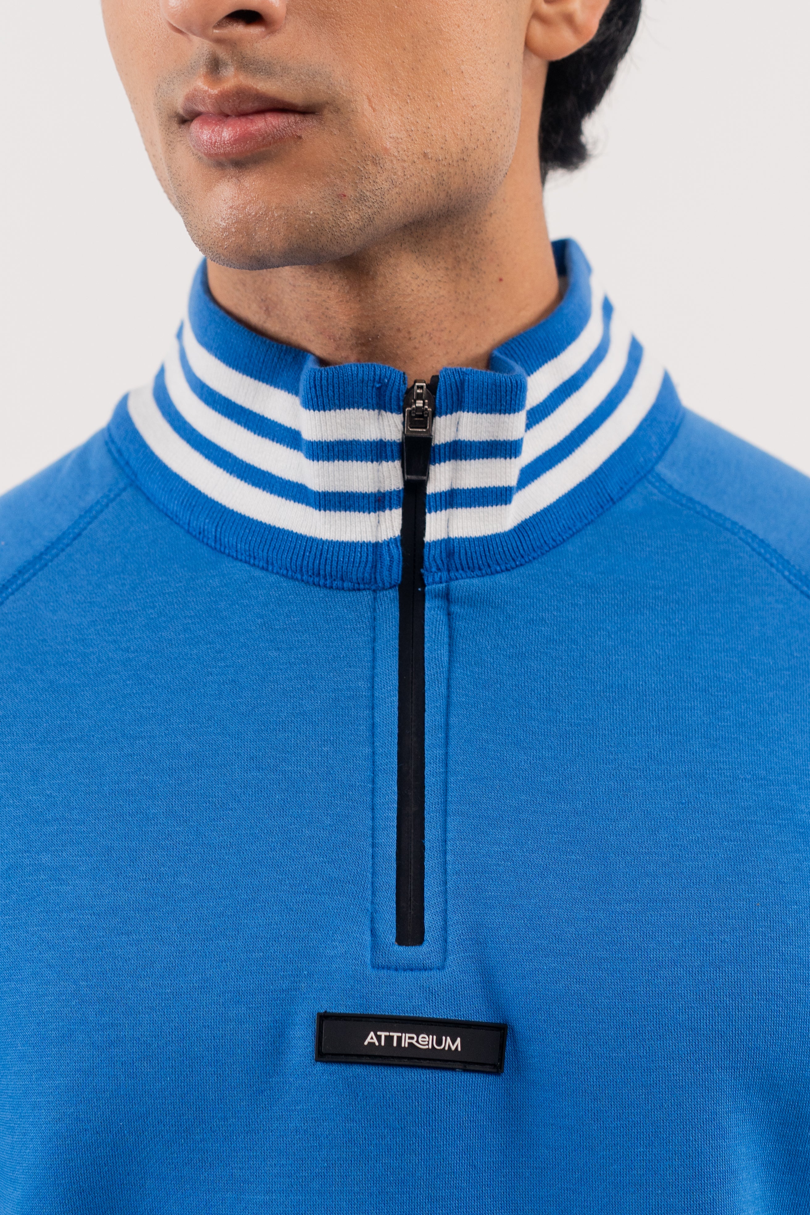 Bold Blue Half-Zip Pullover with Striped Accents